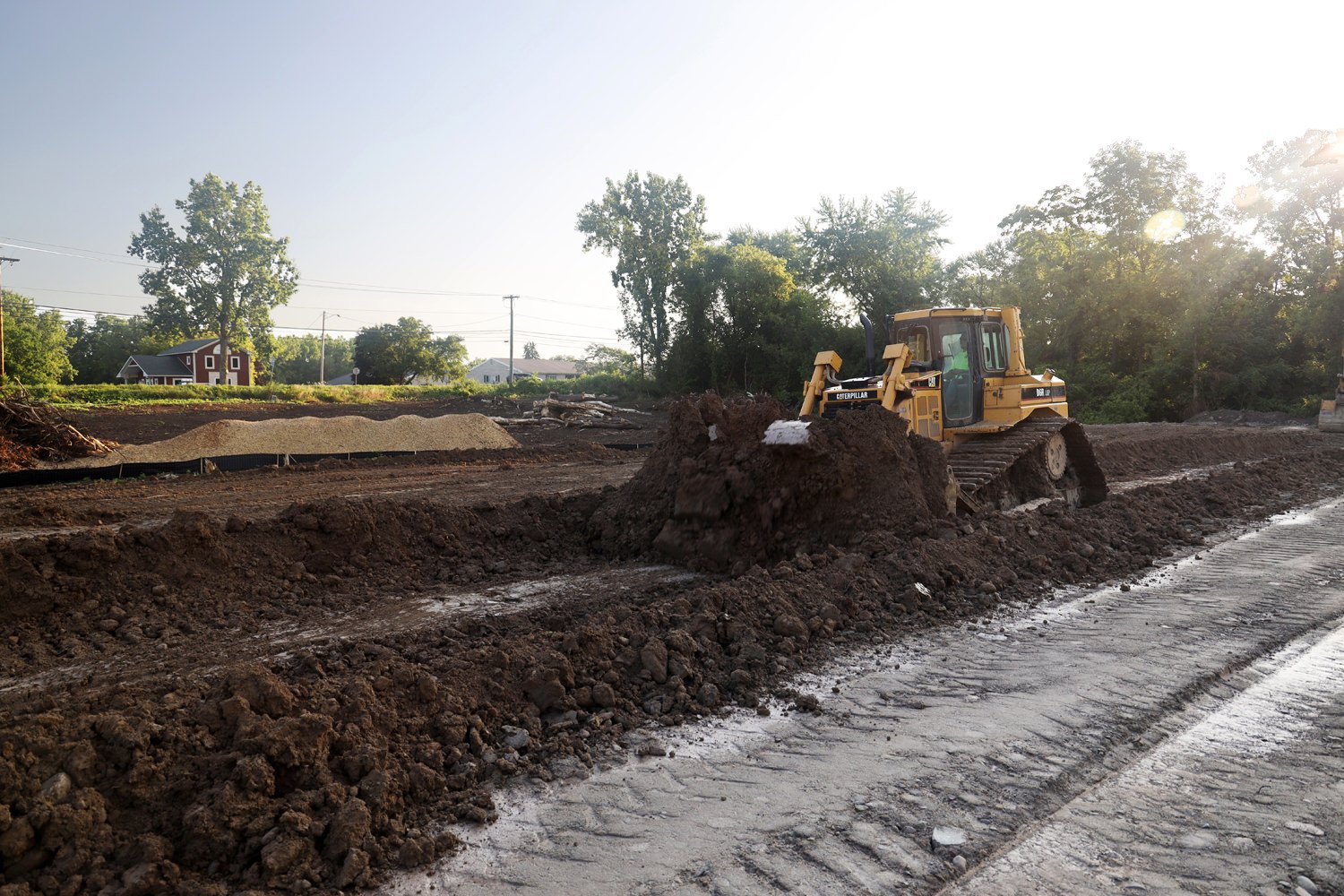 WoodStone Earth equipment clearing a wooded site for new development
